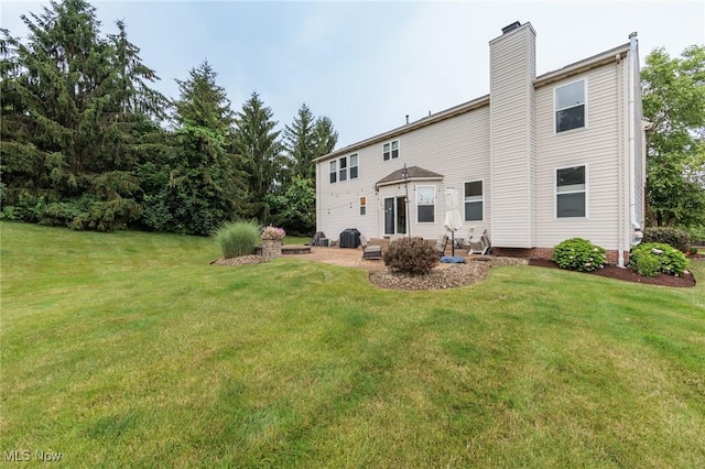 100 Hartford Ct, Broadview Heights, OH 44147 - rear view of property featuring a yard, a chimney, and a patio