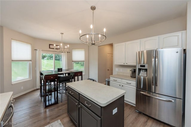100 Hartford Ct, Broadview Heights, OH 44147 - kitchen with stainless steel appliances, a chandelier, white cabinetry, light countertops, and wood finished floors