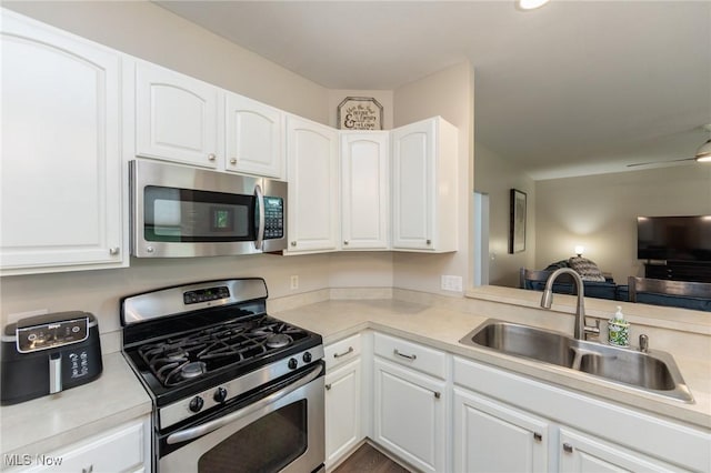 100 Hartford Ct, Broadview Heights, OH 44147 - kitchen featuring appliances with stainless steel finishes, white cabinetry, light countertops, and open floor plan