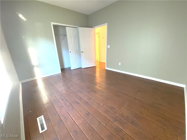 10517 W Ravine View Ct, North Royalton, OH 44133 - unfurnished bedroom with dark wood finished floors and a closet