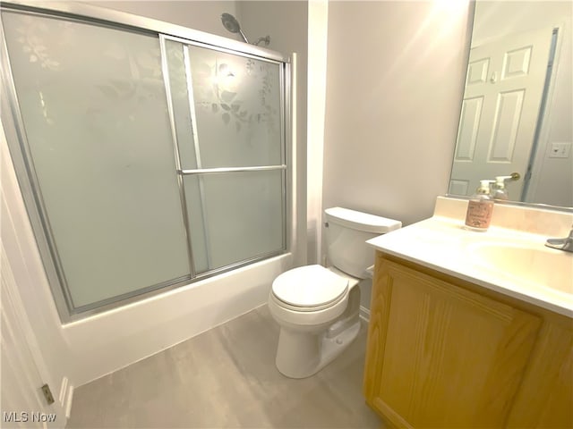 10517 W Ravine View Ct, North Royalton, OH 44133 - bathroom with vanity, bath / shower combo with glass door, and wood finished floors