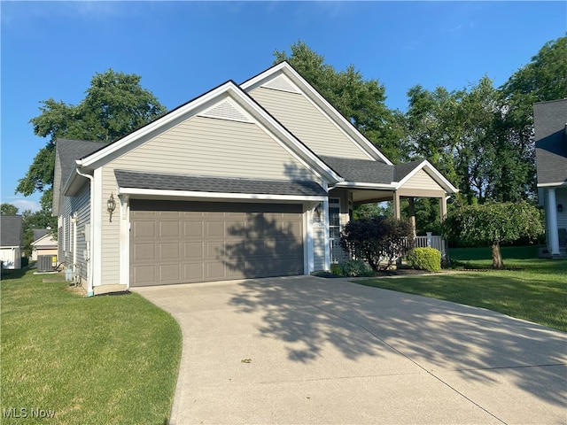10517 W Ravine View Ct, North Royalton, OH 44133 - view of front of property with a garage, driveway, and a front lawn