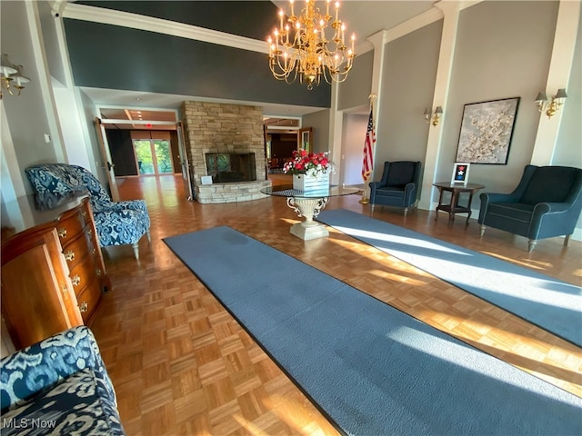 10517 W Ravine View Ct, North Royalton, OH 44133 - exercise area with a chandelier, a towering ceiling, and a fireplace