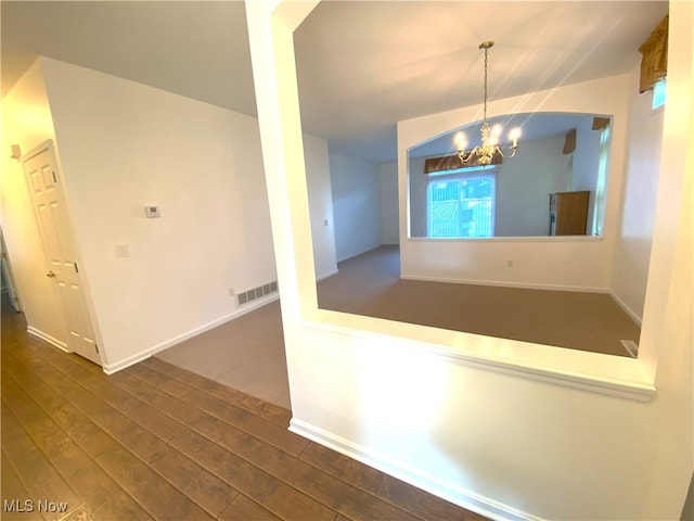 10517 W Ravine View Ct, North Royalton, OH 44133 - unfurnished dining area featuring a chandelier and dark wood-style flooring