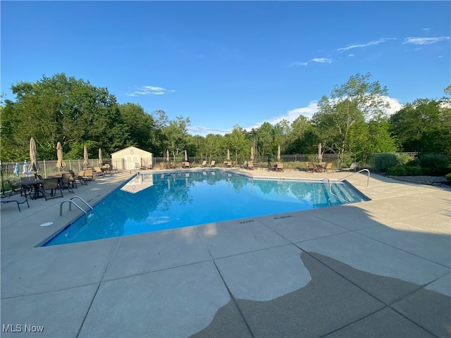 10517 W Ravine View Ct, North Royalton, OH 44133 - community pool with a patio area and view of scattered trees