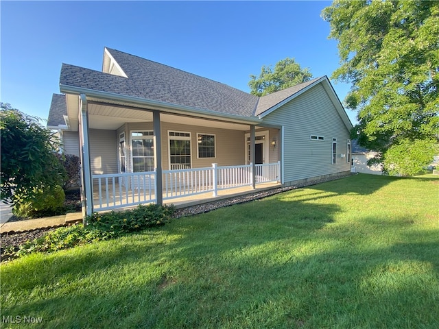 10517 W Ravine View Ct, North Royalton, OH 44133 - rear view of property with a shingled roof and a lawn