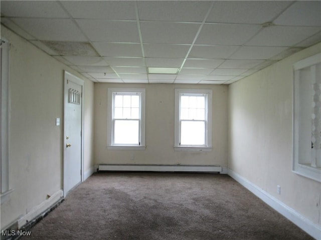 3298 E 143rd St, Cleveland, OH 44120 - carpeted empty room featuring baseboard heating and a paneled ceiling
