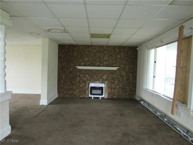 3298 E 143rd St, Cleveland, OH 44120 - unfurnished living room featuring heating unit, a paneled ceiling, carpet, and a fireplace