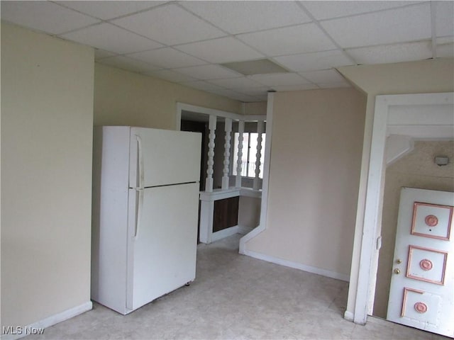 3298 E 143rd St, Cleveland, OH 44120 - kitchen featuring freestanding refrigerator, a drop ceiling, and light floors