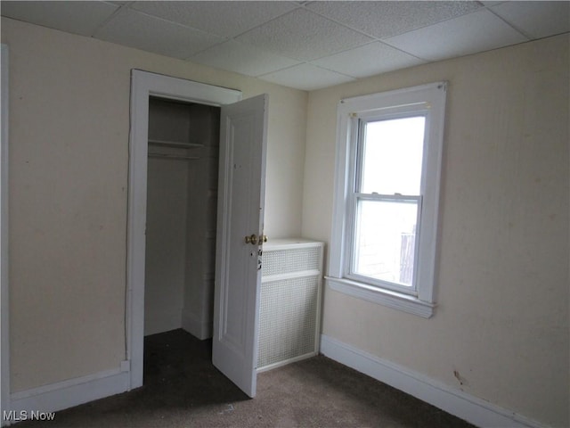 3298 E 143rd St, Cleveland, OH 44120 - unfurnished bedroom featuring a drop ceiling, carpet flooring, and a closet