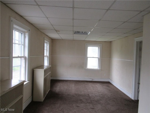 3298 E 143rd St, Cleveland, OH 44120 - spare room with dark carpet and a paneled ceiling