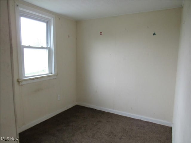 3298 E 143rd St, Cleveland, OH 44120 - unfurnished room with dark colored carpet and baseboards