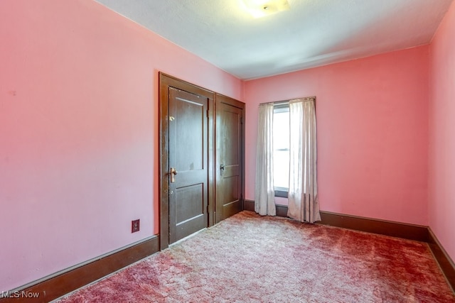 516 Floyd St, Akron, OH 44310 - unfurnished bedroom featuring carpet floors and baseboards