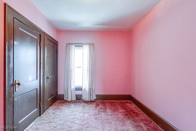 516 Floyd St, Akron, OH 44310 - unfurnished bedroom with carpet and baseboards