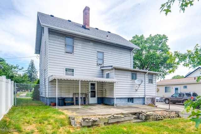 516 Floyd St, Akron, OH 44310 - rear view of property featuring a patio and a chimney