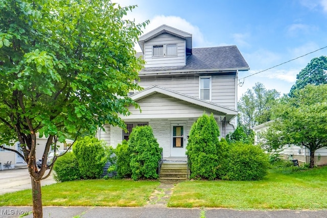 516 Floyd St, Akron, OH 44310 - american foursquare style home with a porch, a front yard, and a shingled roof