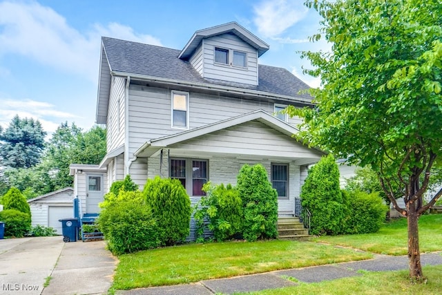 516 Floyd St, Akron, OH 44310 - traditional style home with an outdoor structure, a front yard, covered porch, and roof with shingles