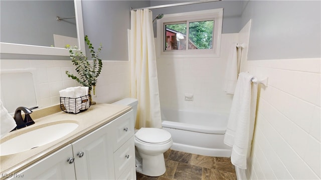 3162 W 231st St, North Olmsted, OH 44070 - bathroom with vanity, tile walls, shower / bath combination with curtain, and wainscoting