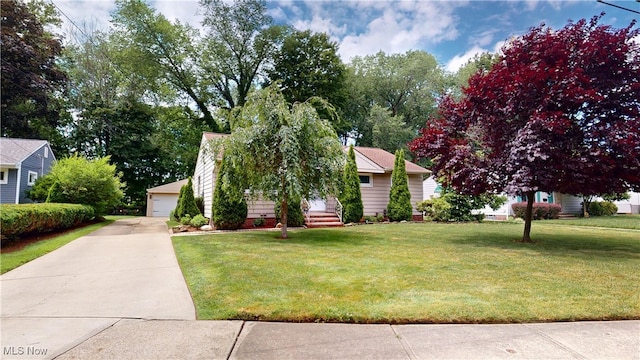3162 W 231st St, North Olmsted, OH 44070 - view of front of property featuring a front yard and a garage