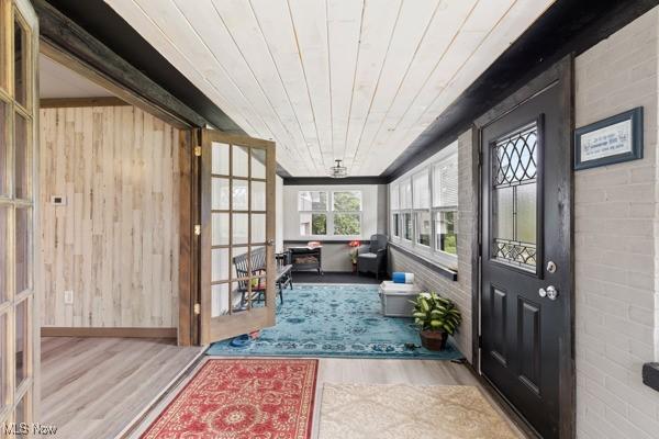 345 Ritchie Ave, Weirton, WV 26062 - sunroom featuring wood finished floors, wood walls, wooden ceiling, and french doors