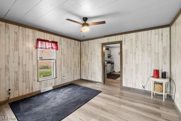 345 Ritchie Ave, Weirton, WV 26062 - spare room with wood walls, ceiling fan, and wood finished floors