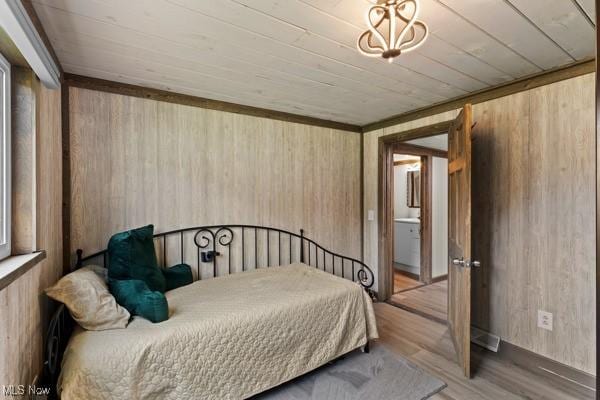 345 Ritchie Ave, Weirton, WV 26062 - bedroom with wooden walls, wood finished floors, and wooden ceiling