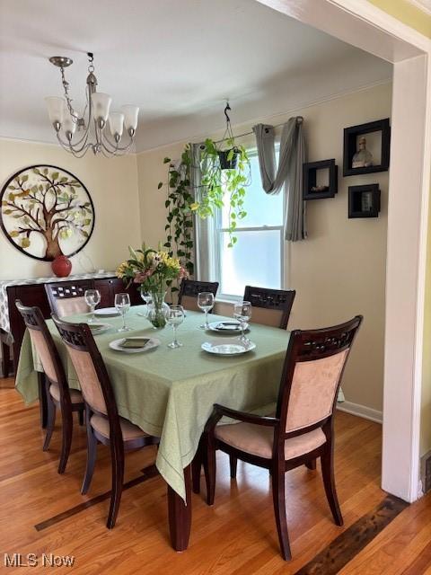 1129 Avondale Rd, South Euclid, OH 44121 - dining space with a chandelier and light wood finished floors