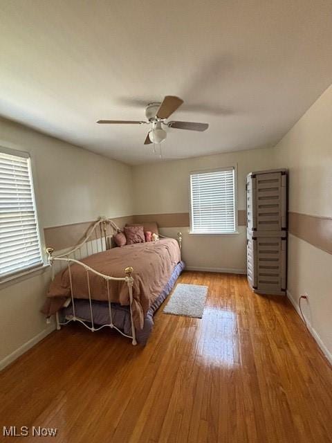 1129 Avondale Rd, South Euclid, OH 44121 - bedroom featuring multiple windows, wood finished floors, and ceiling fan