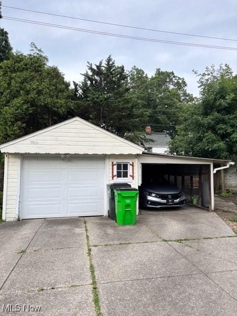 1129 Avondale Rd, South Euclid, OH 44121 - garage featuring a detached garage and concrete driveway