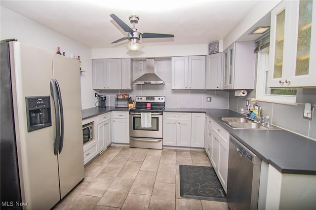 1333 Overlook Dr, Weirton, WV 26062 - kitchen with stainless steel appliances, wall chimney range hood, a ceiling fan, and dark countertops
