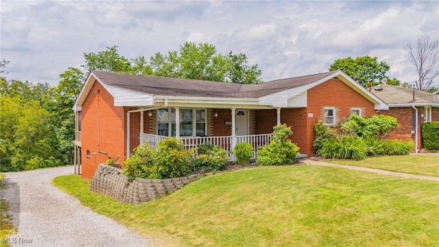 1333 Overlook Dr, Weirton, WV 26062 - single story home featuring brick siding, a front lawn, a porch, and gravel driveway