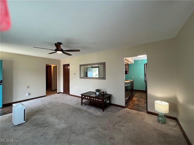 484 Louella Ave, Chester, WV 26034 - living room with dark carpet and a ceiling fan