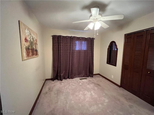 484 Louella Ave, Chester, WV 26034 - unfurnished bedroom with light colored carpet, a closet, and a ceiling fan