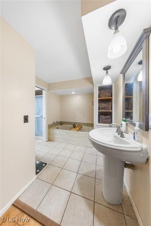 1141 Las Olas Blvd NW, North Canton, OH 44720 - bathroom featuring tile patterned floors and baseboards