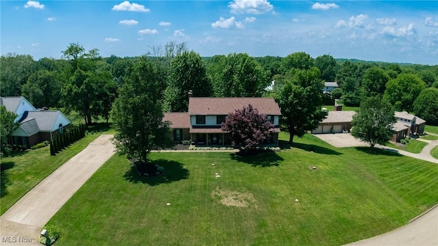 1141 Las Olas Blvd NW, North Canton, OH 44720 - view of front facade with concrete driveway and a front yard