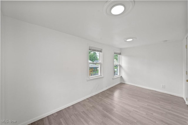 1170 Moneta Ave, Aurora, OH 44202 - empty room with baseboards and wood finished floors