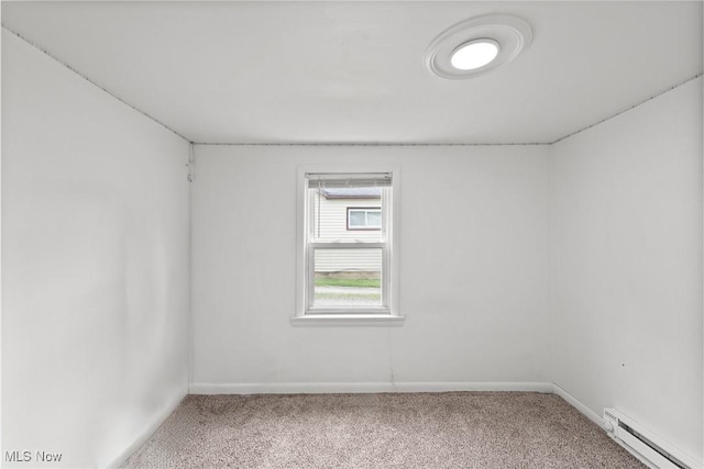 1170 Moneta Ave, Aurora, OH 44202 - spare room with a baseboard heating unit and carpet floors