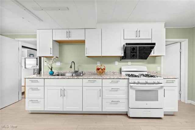1170 Moneta Ave, Aurora, OH 44202 - kitchen featuring white range with gas cooktop, white cabinetry, and light wood finished floors