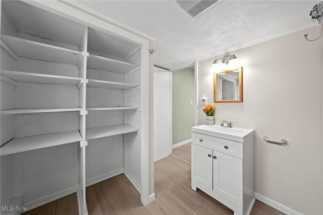 1170 Moneta Ave, Aurora, OH 44202 - bathroom featuring vanity and wood finished floors