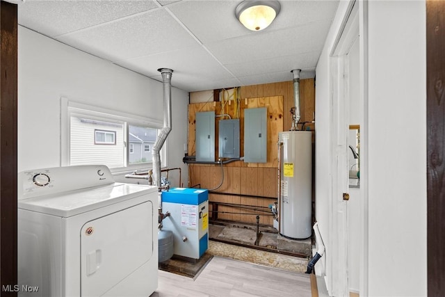 1170 Moneta Ave, Aurora, OH 44202 - laundry area featuring washer / clothes dryer, water heater, electric panel, light wood-style flooring, and wooden walls