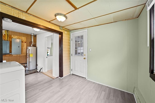 1170 Moneta Ave, Aurora, OH 44202 - kitchen featuring water heater, washer / clothes dryer, electric panel, wooden walls, and wood finished floors