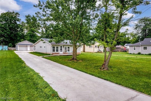 1170 Moneta Ave, Aurora, OH 44202 - ranch-style house featuring an outdoor structure, a garage, and a front lawn