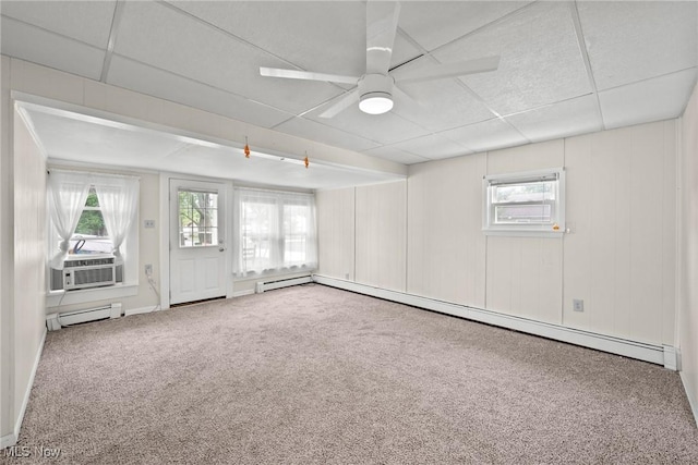 1170 Moneta Ave, Aurora, OH 44202 - carpeted empty room with a paneled ceiling, a baseboard heating unit, plenty of natural light, cooling unit, and ceiling fan