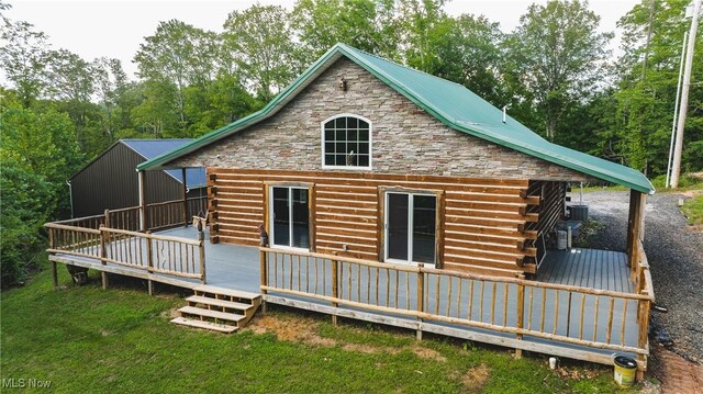4278 Newbury Rd, Little Hocking, OH 45742 - rear view of property with log exterior, a wooden deck, stone siding, and a yard