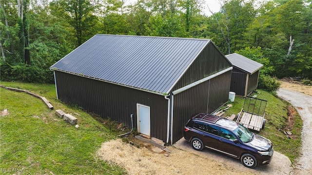 4278 Newbury Rd, Little Hocking, OH 45742 - view of pole building with a lawn and a forest view