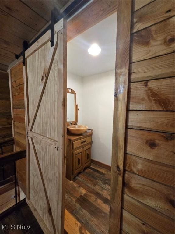 4278 Newbury Rd, Little Hocking, OH 45742 - corridor featuring a barn door and dark wood finished floors