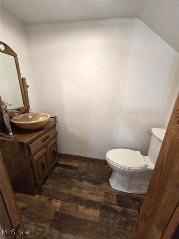 4278 Newbury Rd, Little Hocking, OH 45742 - bathroom with vanity, vaulted ceiling, and wood finished floors