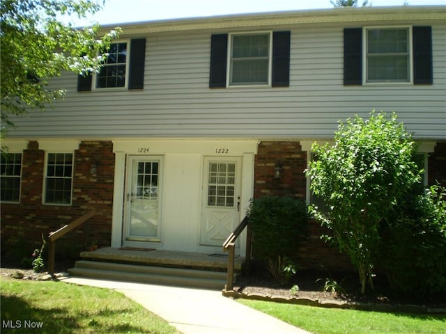 1222 N Carpenter Rd, Brunswick, OH 44212 - colonial-style house with brick siding