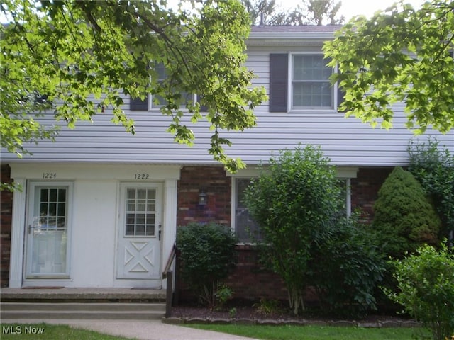 1222 N Carpenter Rd, Brunswick, OH 44212 - view of front facade featuring brick siding
