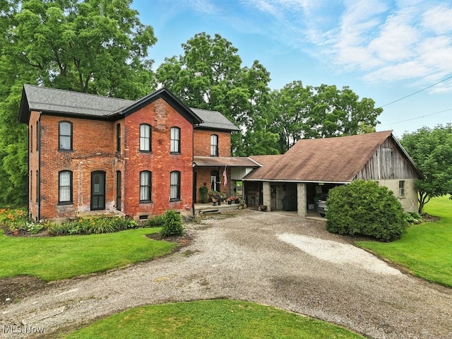 7298 Akron Rd, Sterling, OH 44276 - view of front of house with driveway, a front lawn, and brick siding